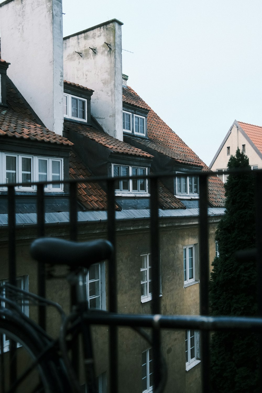 a bicycle parked in front of a tall building