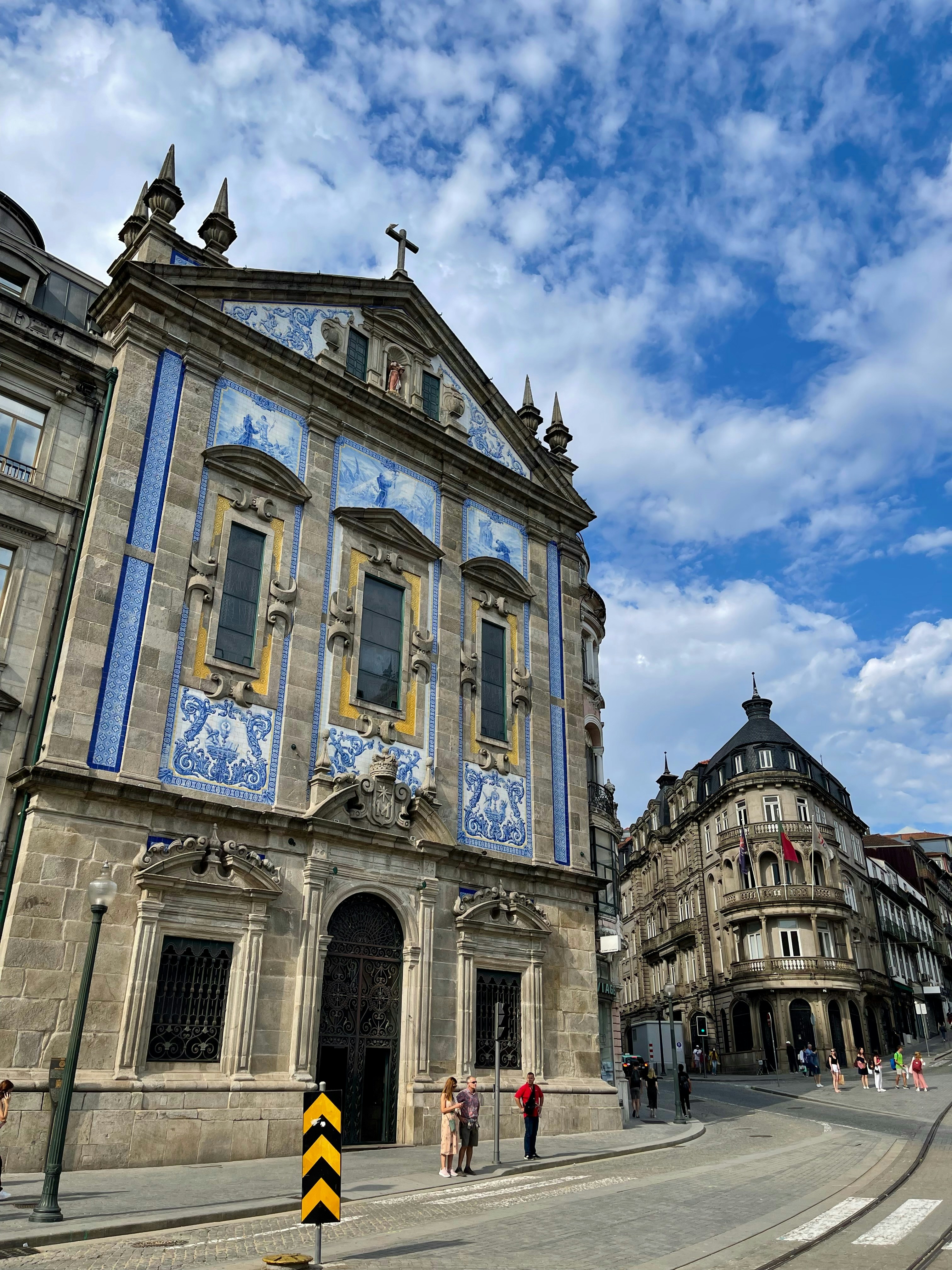 a blue and white building with a cross on the top of it