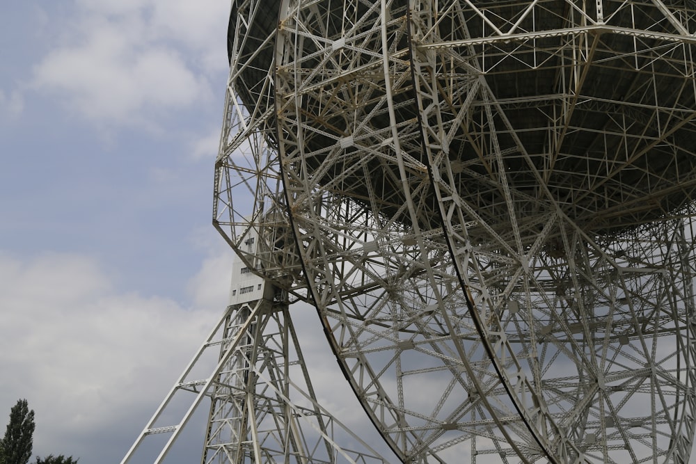 a large metal structure with a clock on top