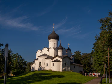 Serbian Orthodox church in Kosovo surrounded by community members during a cultural event.