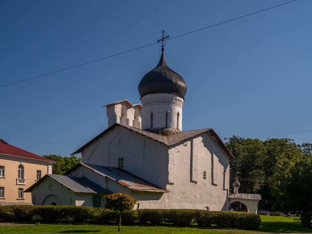 a church with a steeple on a sunny day