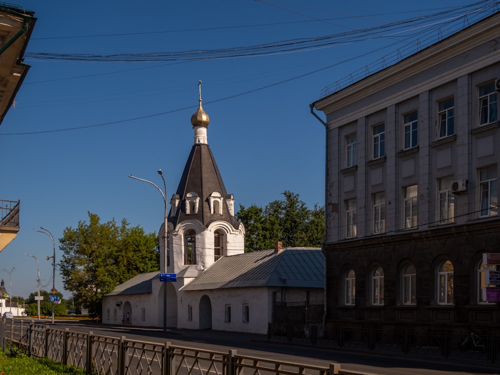 a church with a steeple on a sunny day