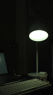 A warm, inviting workspace with creative tools and a glowing light bulb symbolizing bright ideas.