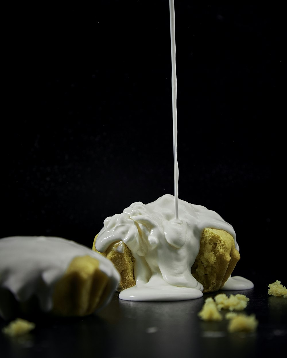 a piece of cake is being drizzled with icing