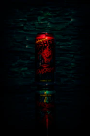 A vibrant can of Divorox energy drink with splashes of bright colors and bubbles around it.