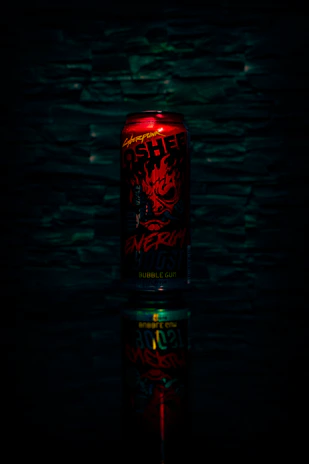 Close-up of a Long Jump energy drink can with vibrant splash effects.
