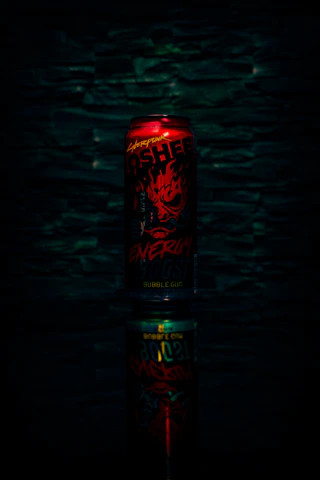 Close-up of Long Jump energy drink can with dynamic splash effect.