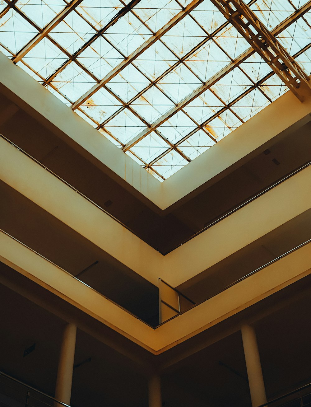 the ceiling of a building with a glass roof