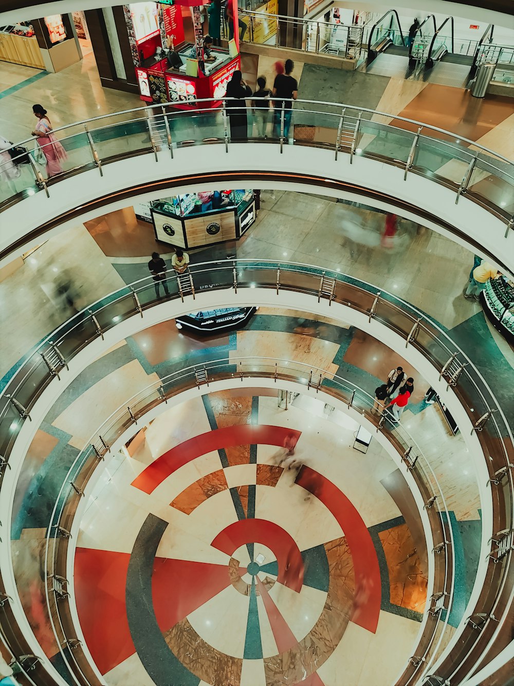 an overhead view of a shopping mall with people walking around