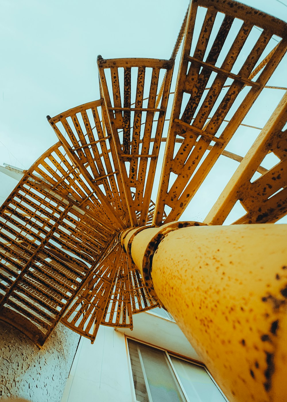 a close up of a wooden structure near a building