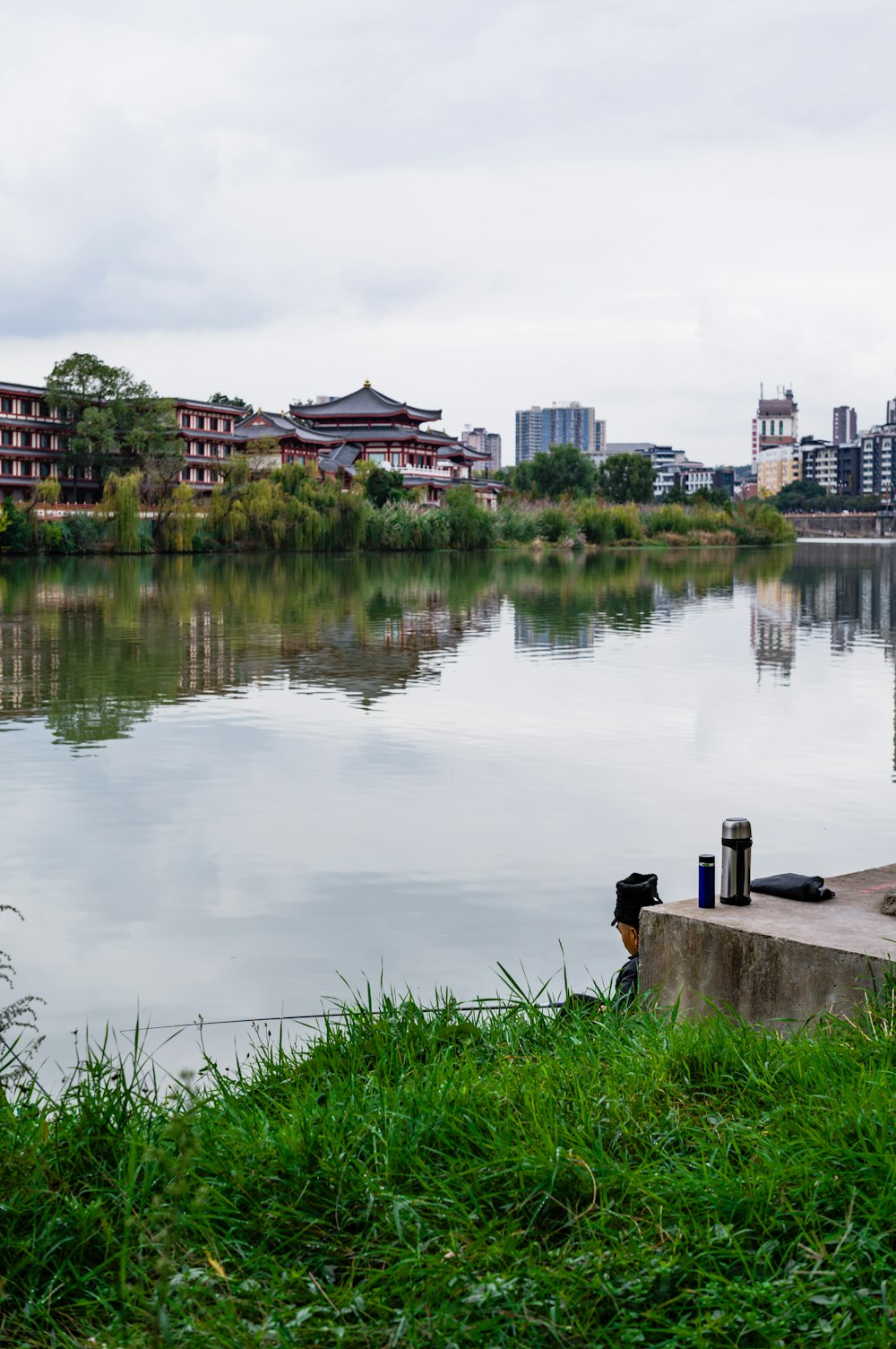 a body of water with buildings in the background