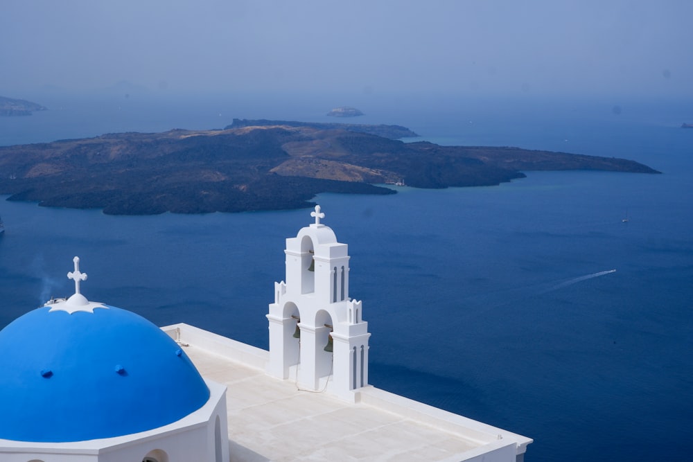 a white and blue church with a blue dome