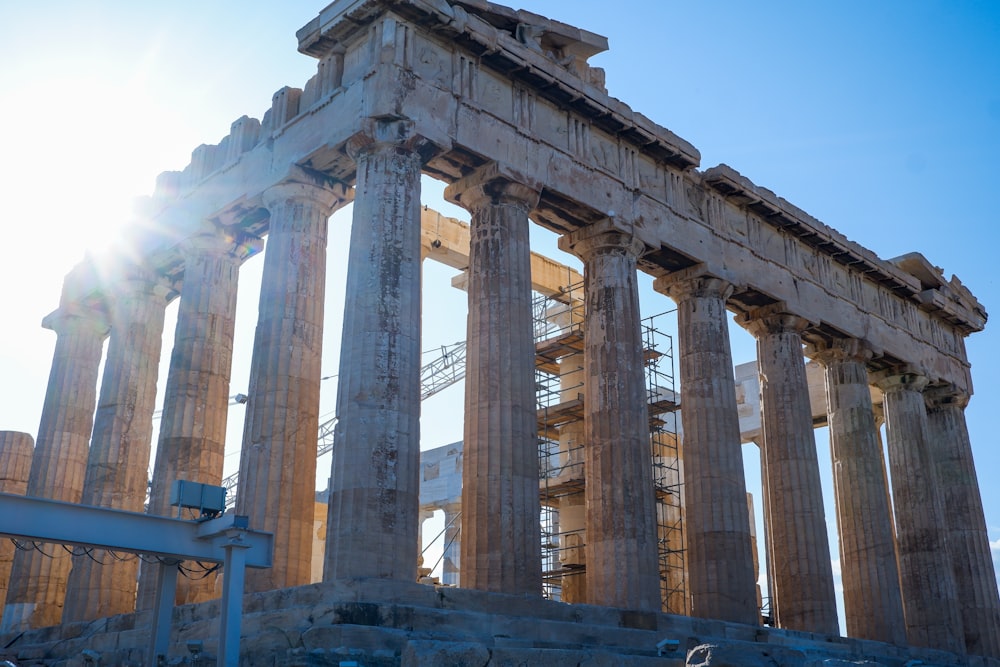 the sun shines brightly on the ruins of a temple