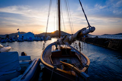 A boat moored at sunset in the harbour at Naoussa, Paros