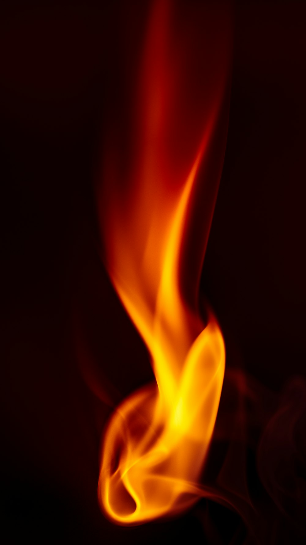 a close up of a fire on a black background