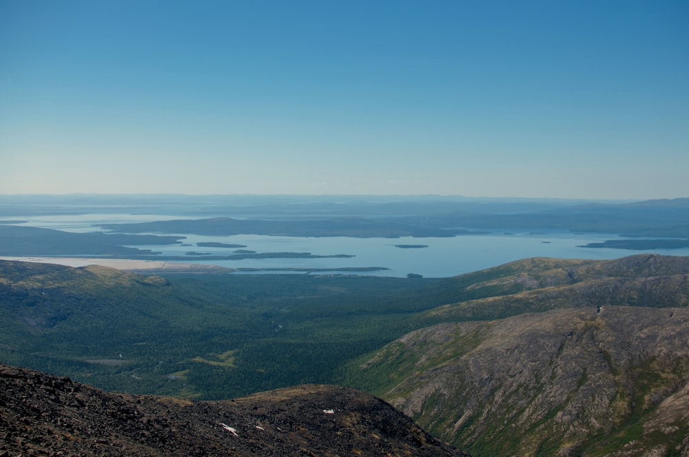 a view of a lake from the top of a mountain