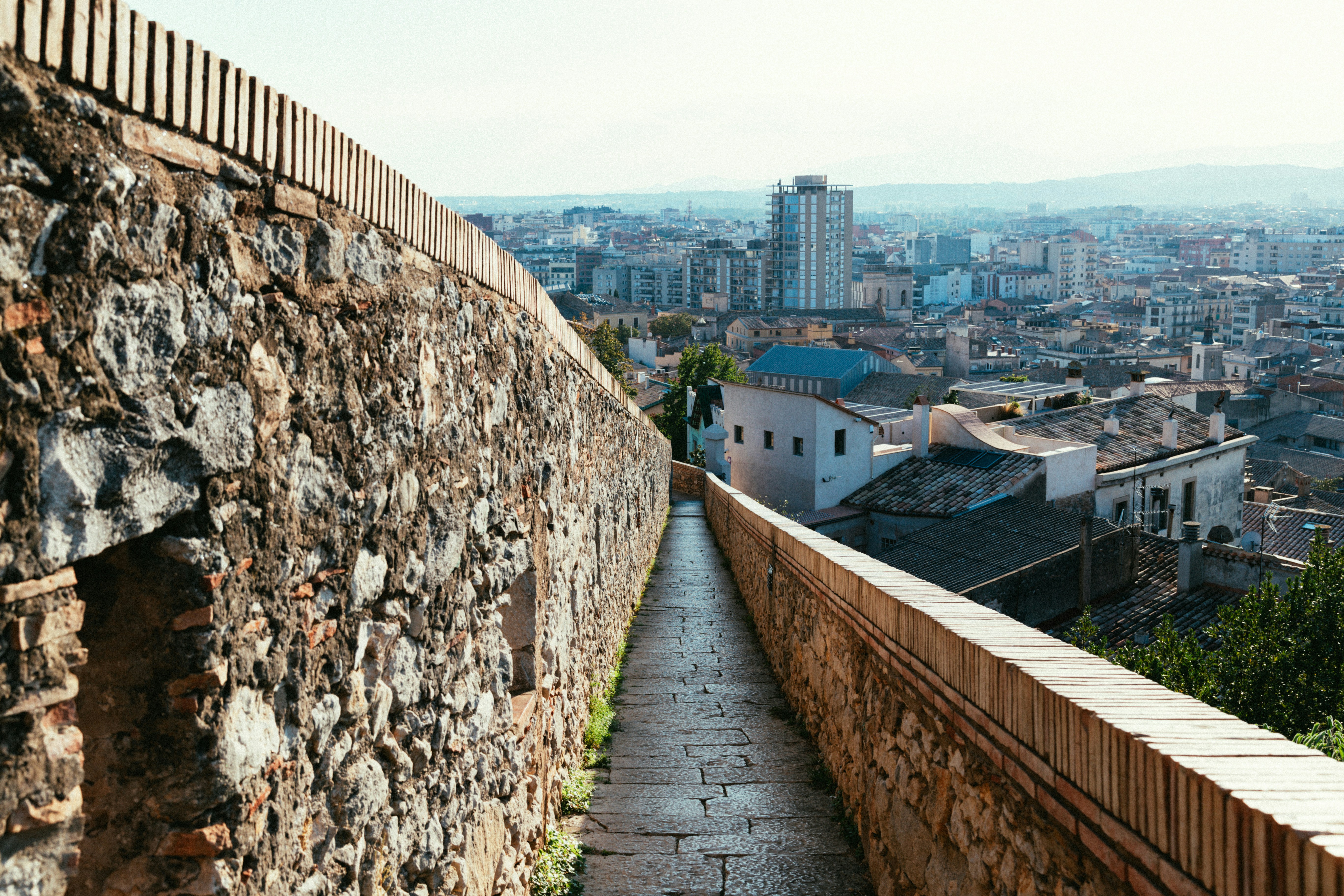 a view of a city from the top of a hill