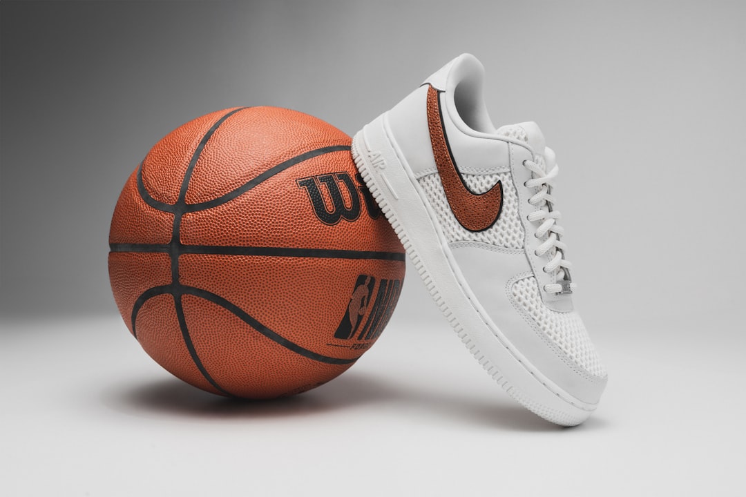 a pair of shoes and a basketball on a gray background, Nike Air Force 1