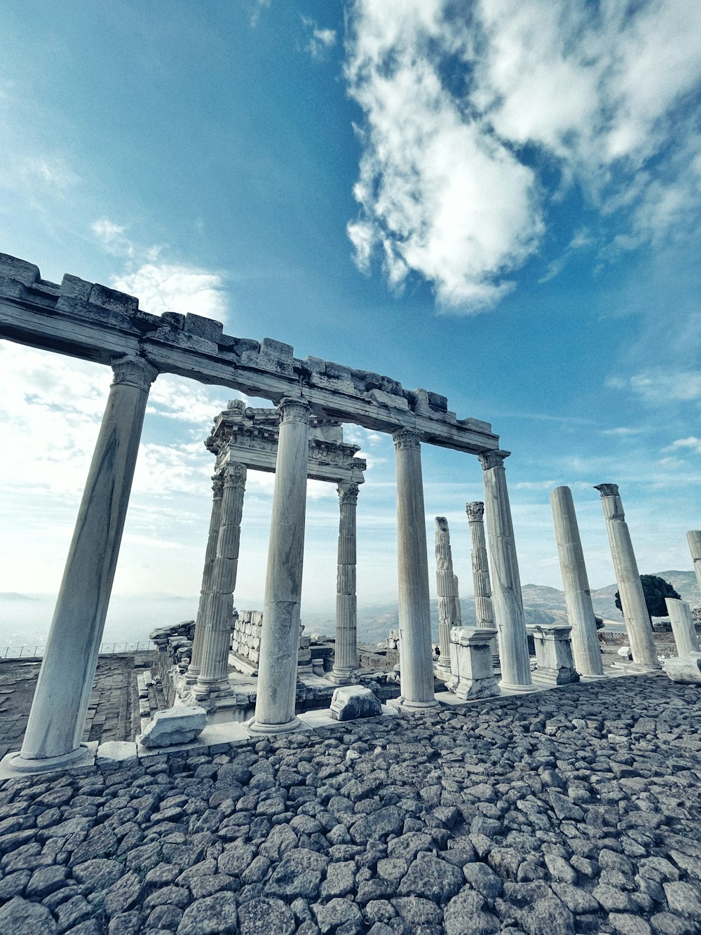 a bunch of pillars that are standing in the dirt