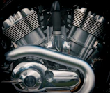 A close-up of a motorcycle engine being repaired.