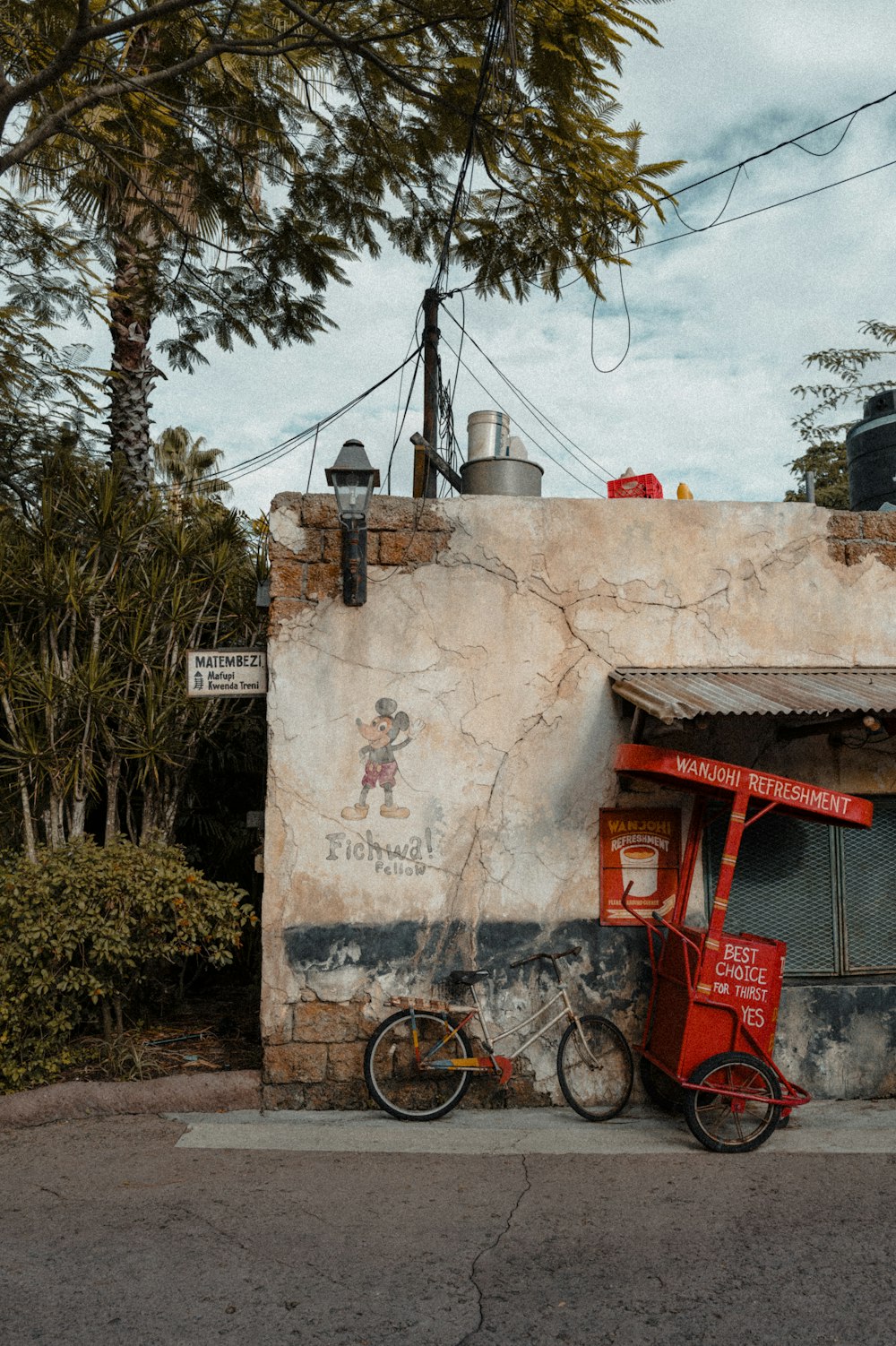 a red bike parked in front of a building