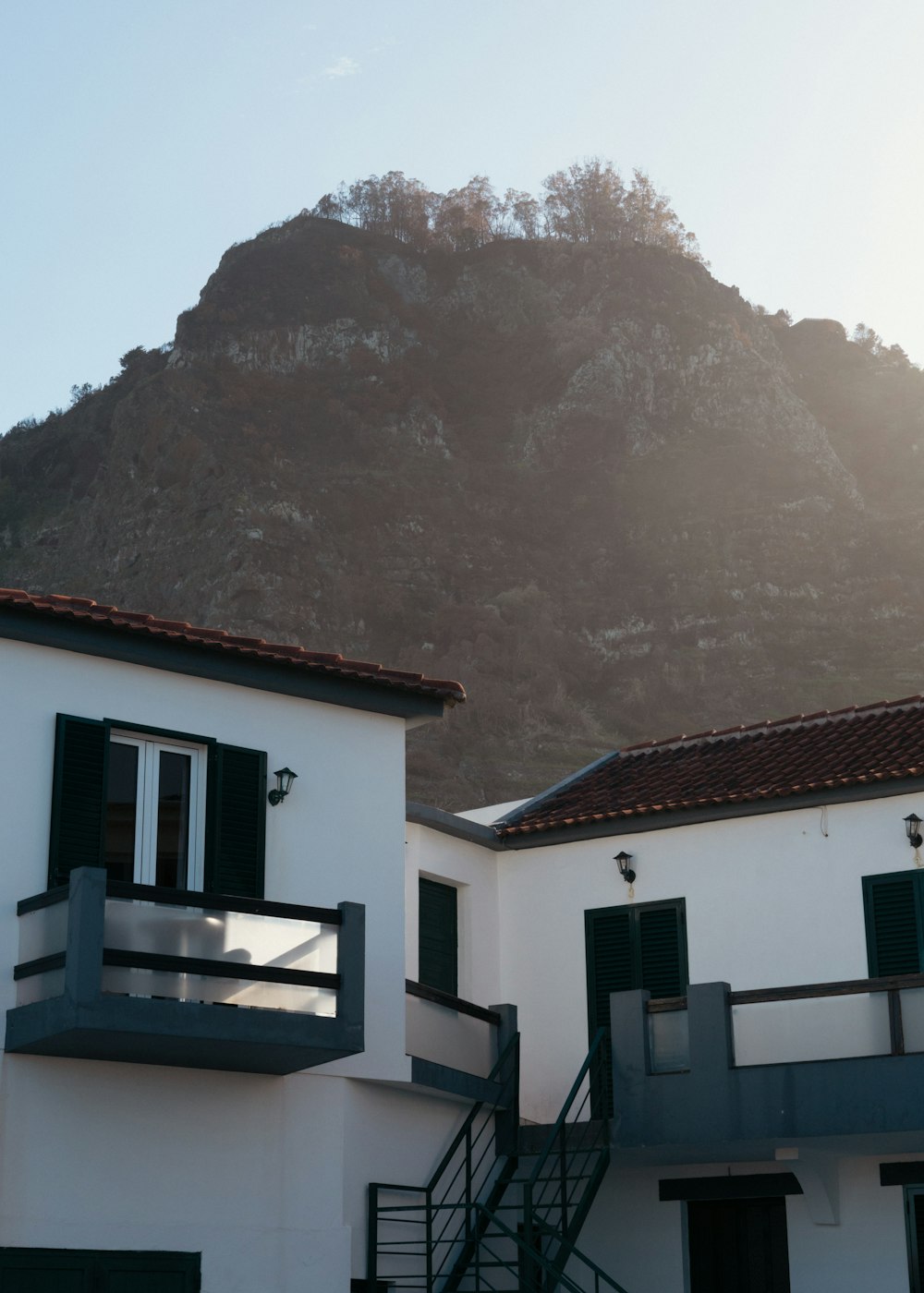 a building with a mountain in the background