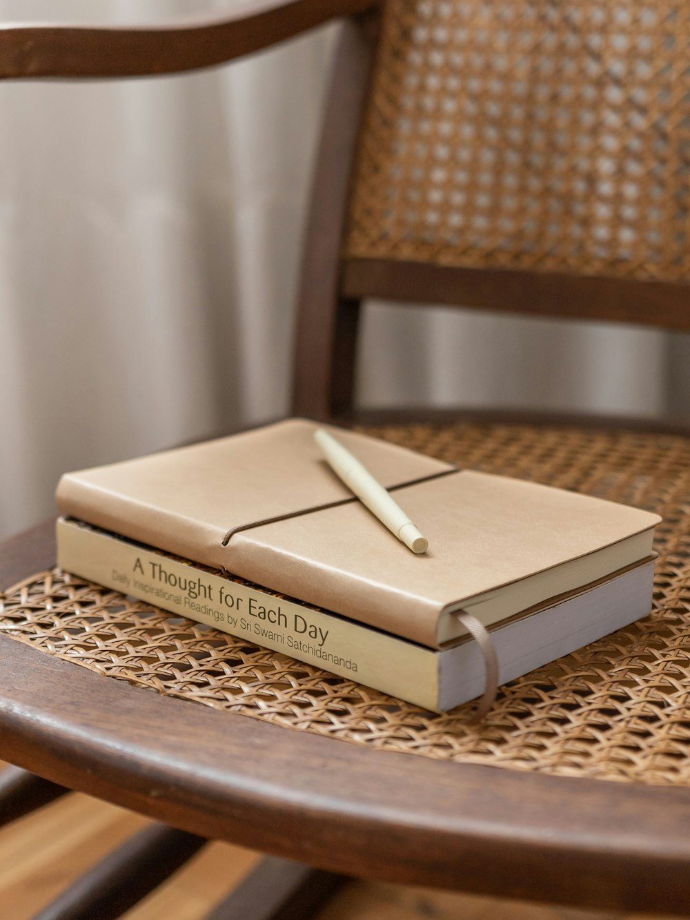 a book sitting on top of a wooden chair