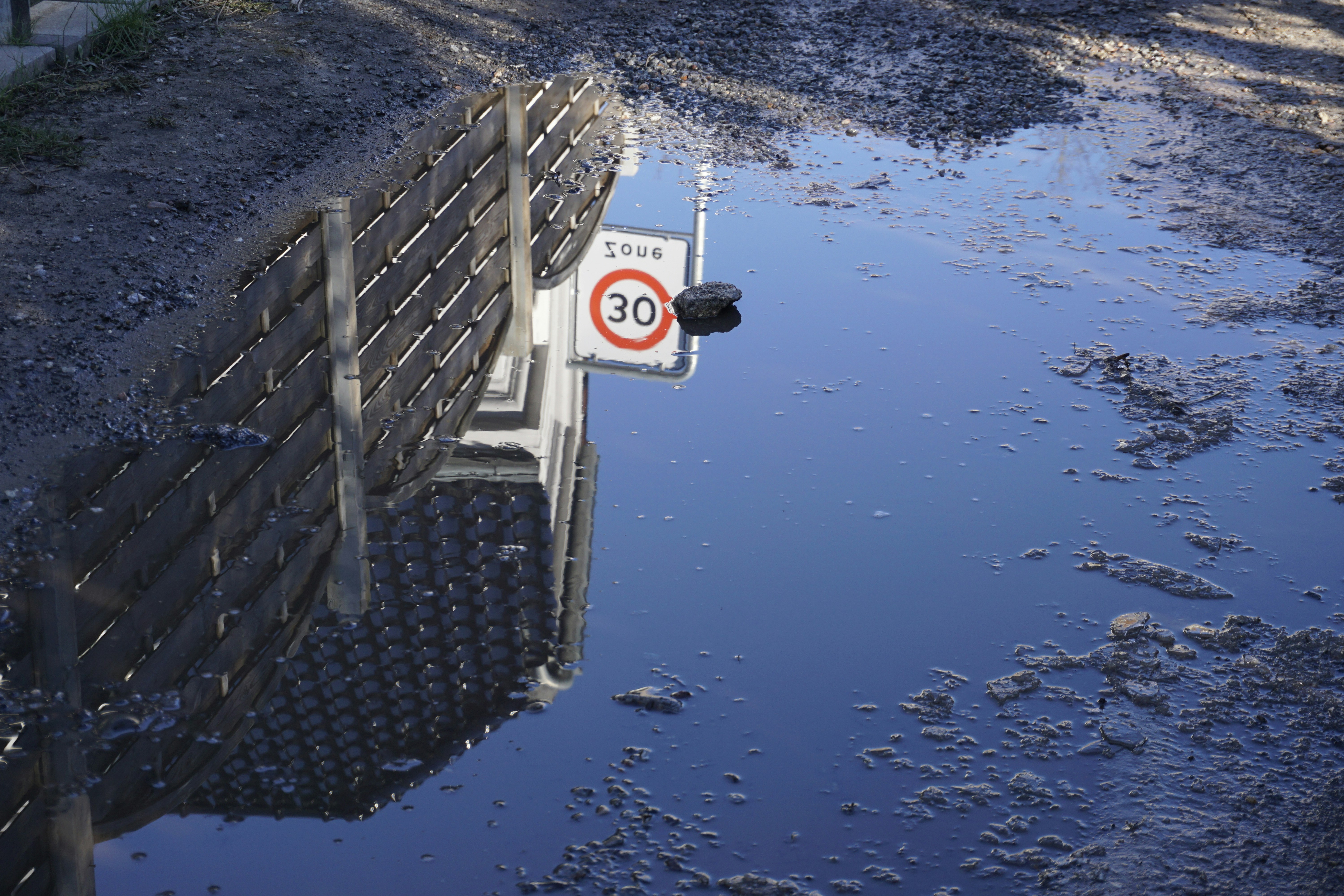 a sign that is on the side of a road