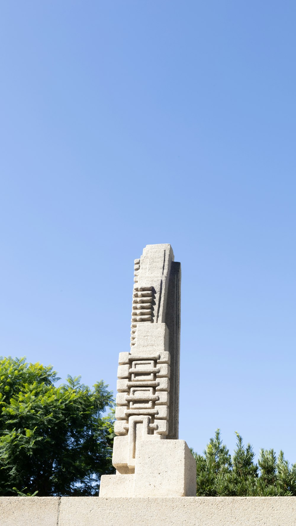 a monument with a clock on top of it