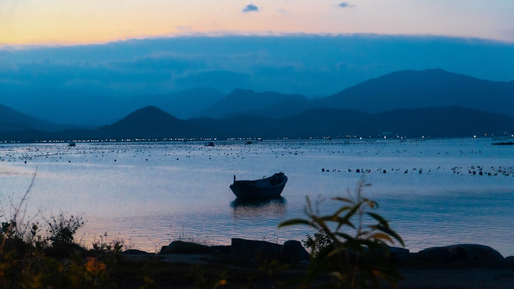 a boat floating on top of a large body of water