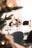 An elegant party table adorned with festive tableware and floral centerpieces.