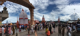 Wide shot of the temple courtyard bustling with visitors during a festival.