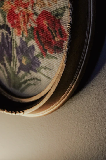 A cozy living room wall adorned with a vibrant, intricately patterned tapestry from velora.