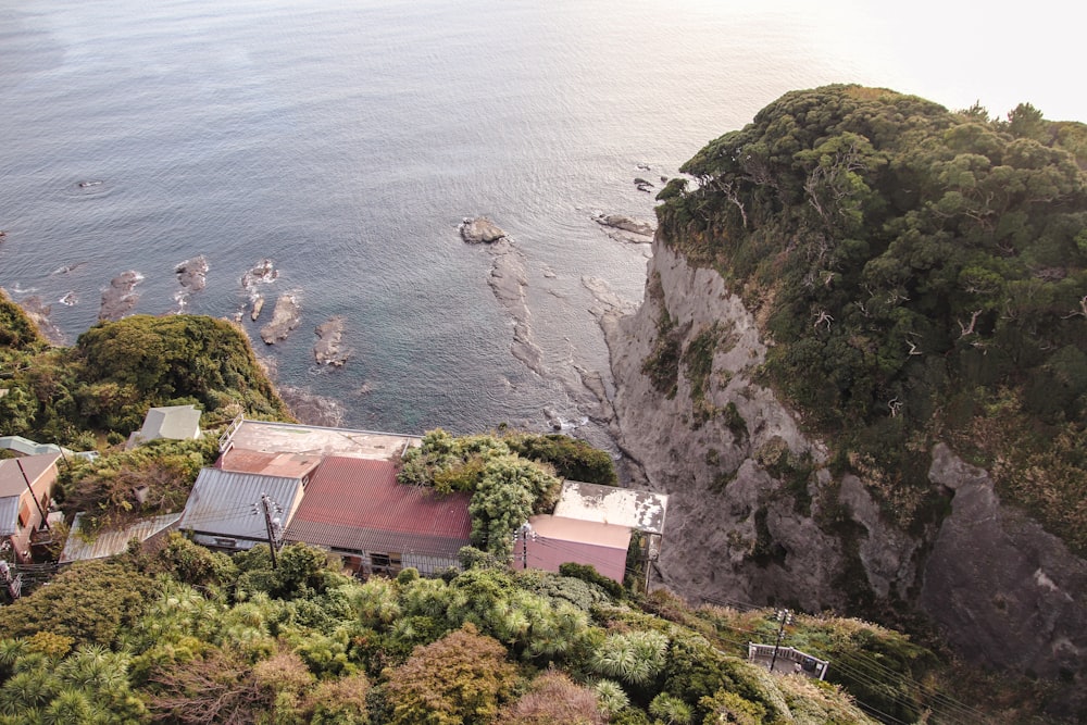 an aerial view of a house on the edge of a cliff