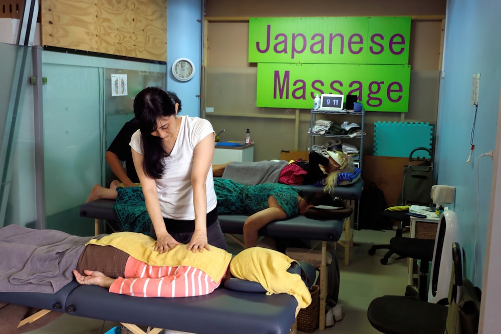 a woman getting a massage in a room