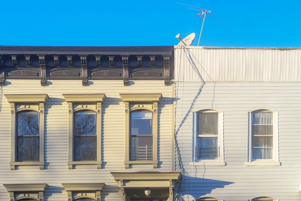 a white building with a clock on the front of it