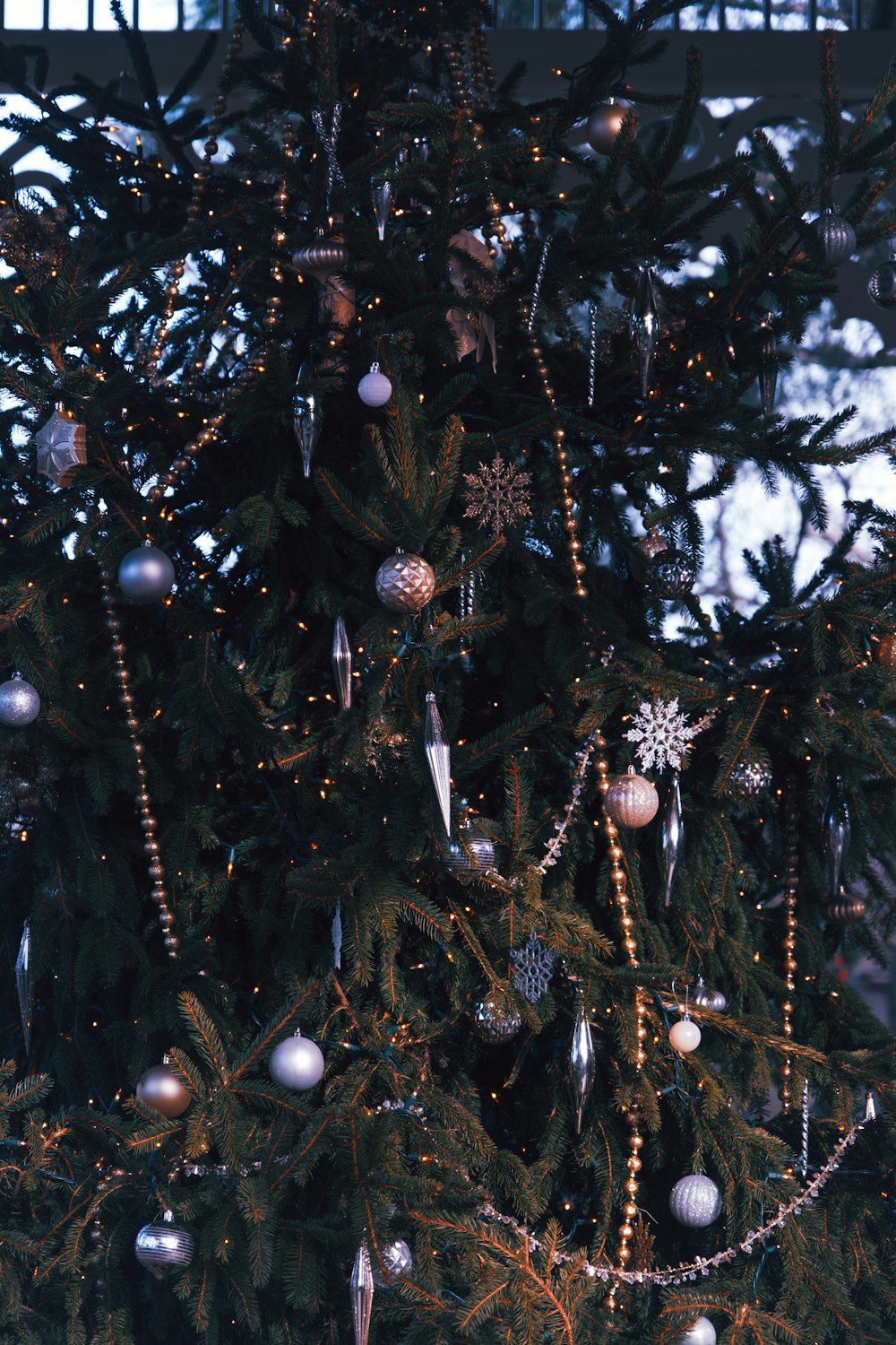 a christmas tree with ornaments and lights on it