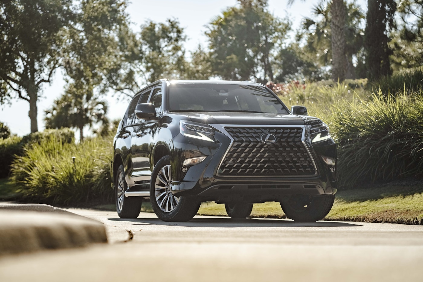 Black Lexus GX SUV at sunset