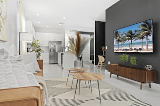 A sleek, modern living room featuring minimalist furniture and bold accent colors.