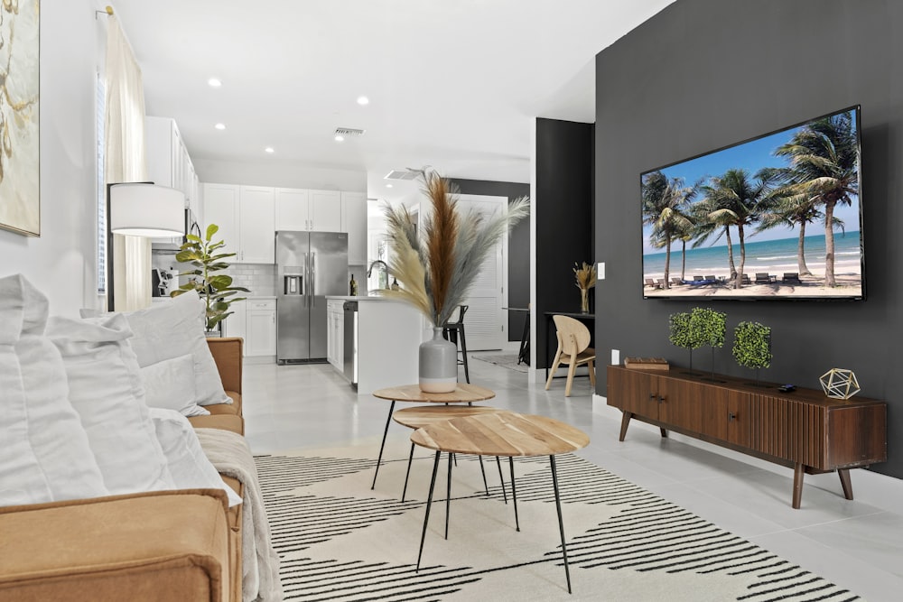 a living room filled with furniture and a flat screen tv