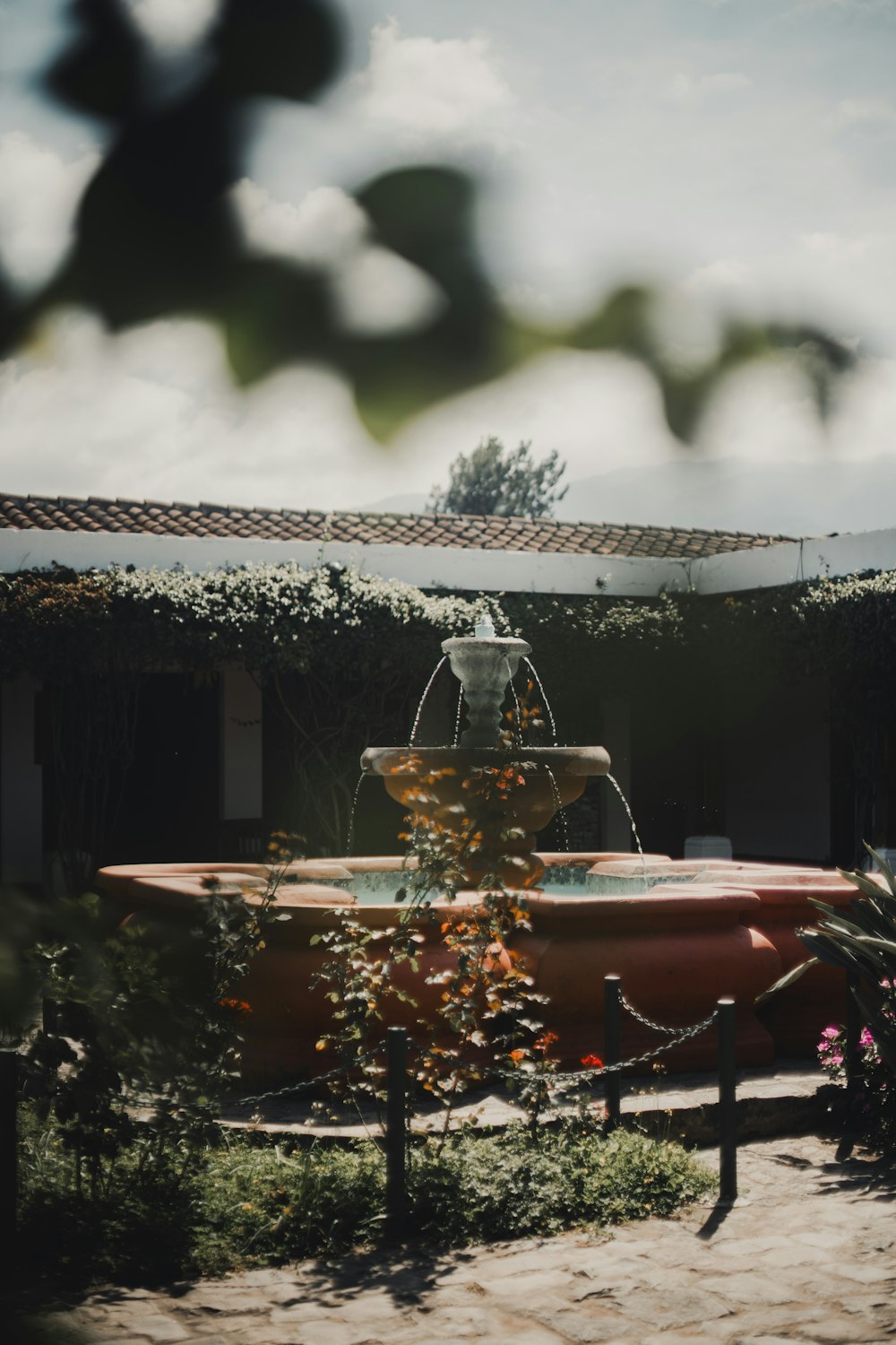 a water fountain in the middle of a courtyard