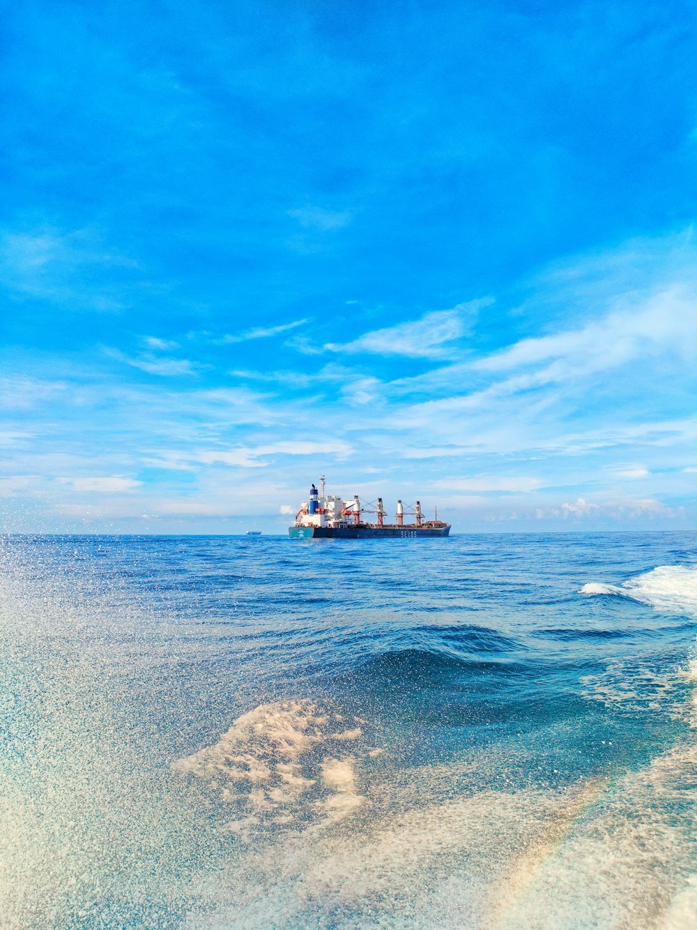 a large boat floating on top of a body of water