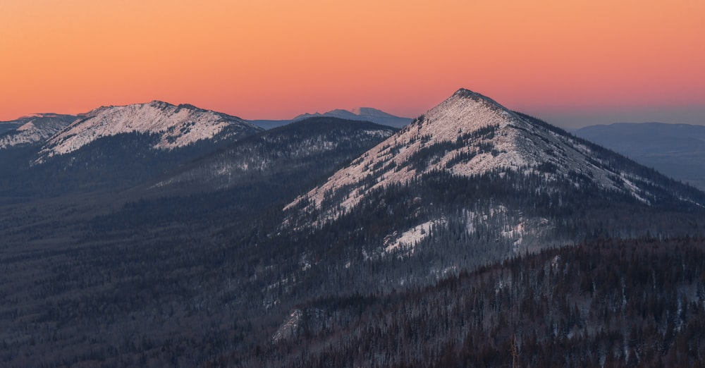 a view of a mountain range at sunset