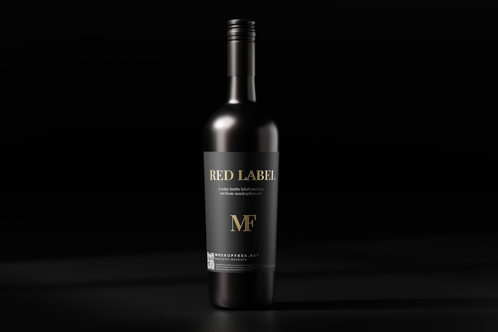 a bottle of red wine on a black background