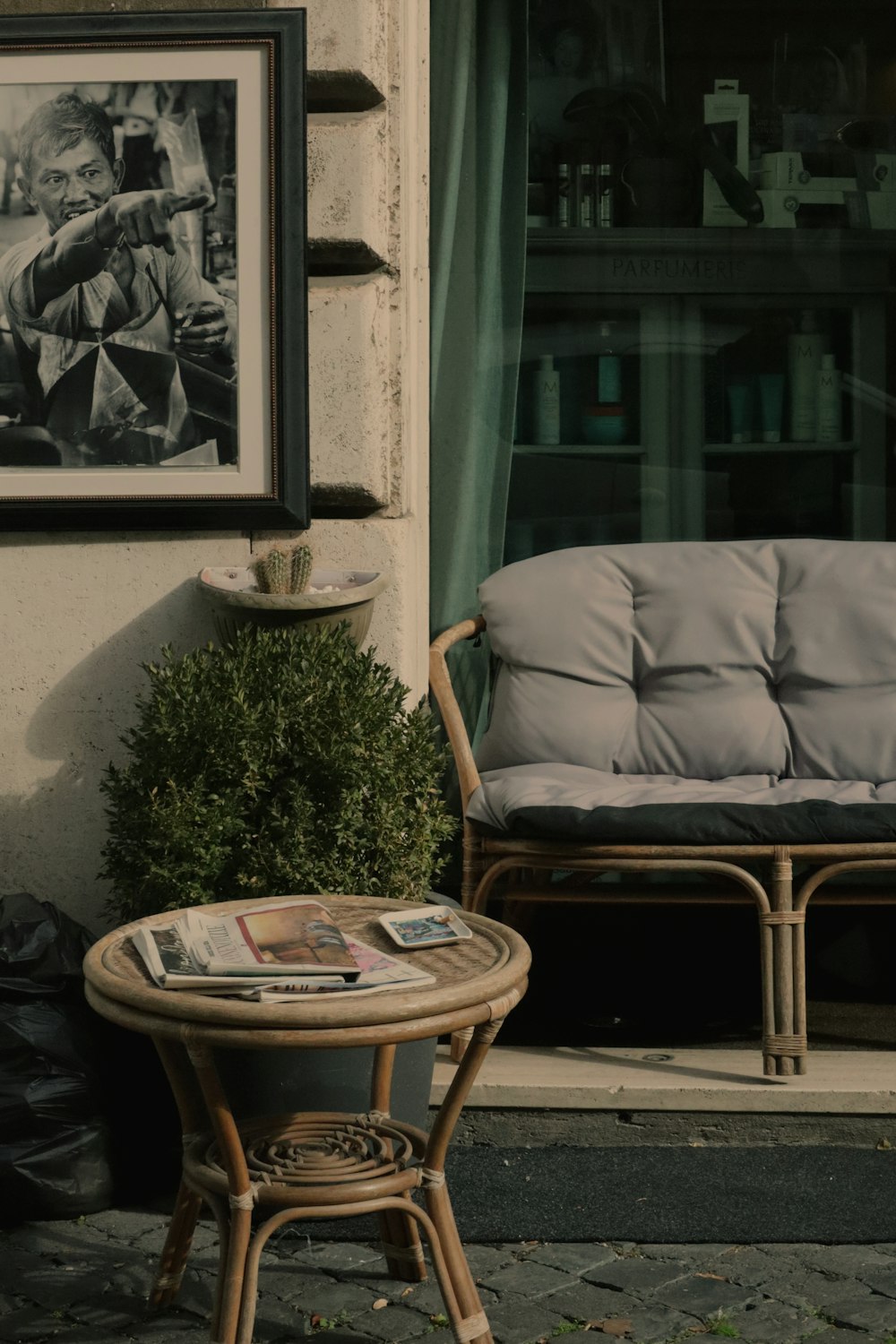 a couch and a table outside of a building