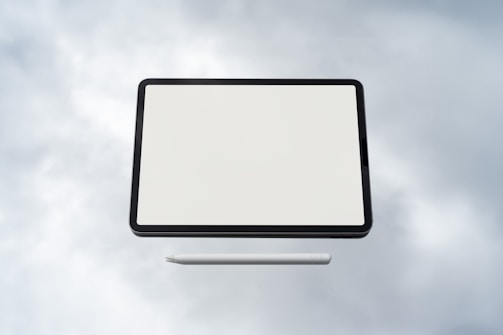 Close-up of hands configuring cloud services on a tablet.