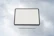 Man using a tablet with cloud service icons floating around.