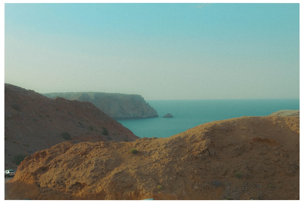 a view of a body of water from a hill