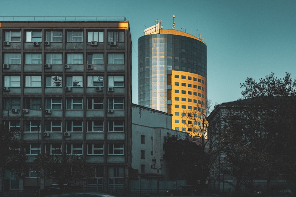 a tall building sitting next to a tall building