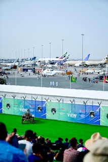 A busy airport scene with various cargo operations in progress.